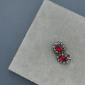 Pair of Ruby Bloom Earrings featuring double-cluster red crystals in a gold-plated finish, handcrafted 
