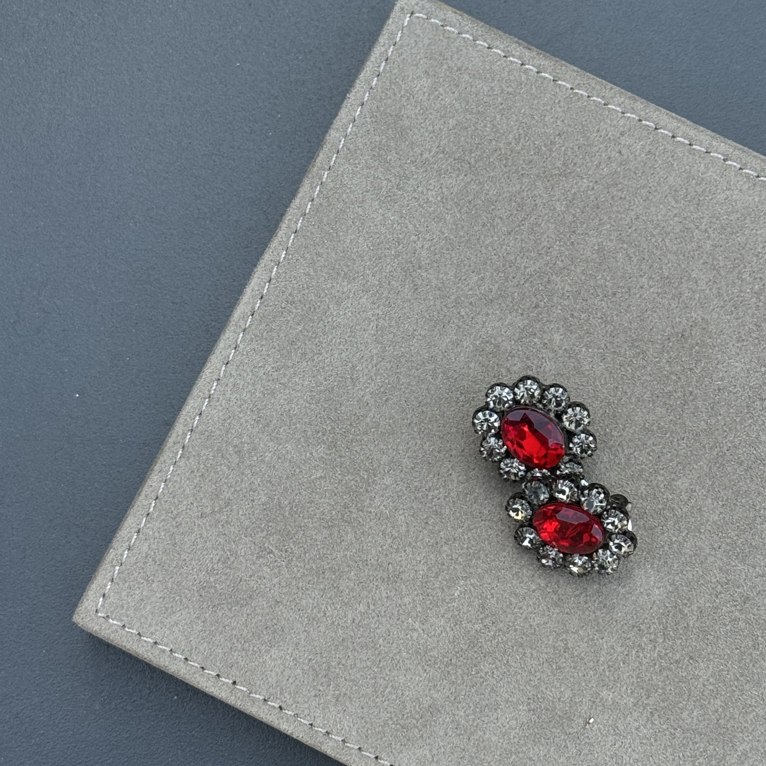 Pair of Ruby Bloom Earrings featuring double-cluster red crystals in a gold-plated finish, handcrafted 